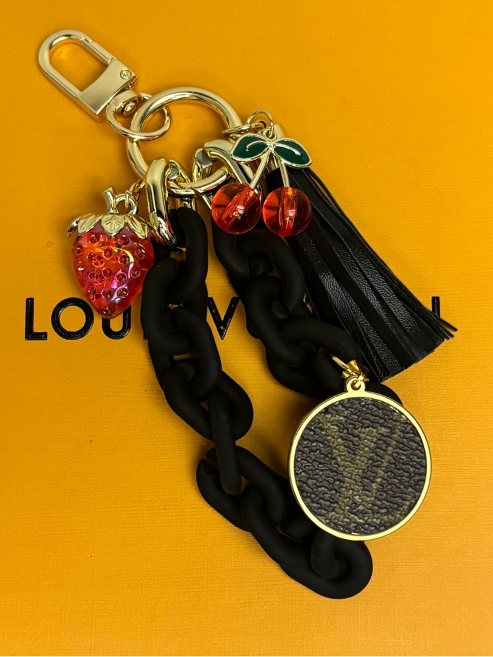 Louis Vuitton Black Chain
Tassel Bag Charm 
, Monogram
Disc Gold tone hardware